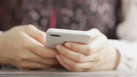 Close up Woman checking email with mobile phone at a coffee shop Stock Footage 152610208