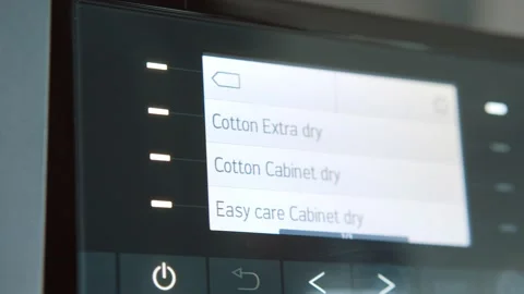 Close Up Of Woman Choosing Cycle Program On Washing Machine. Stock-Footage 138217929