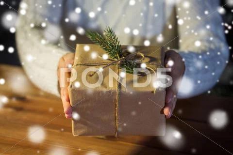 Close up of woman with christmas gift or parcel Stock Photos