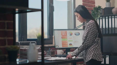 Close up of woman comparing data on papers Stock Footage 166010818