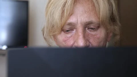 Close-up of woman at computer reading important documents Stock Footage 284228196