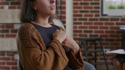 Close up of woman crying and sharing story about alcohol addiction at group Stock Footage 165155488