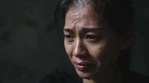 Close-up of a woman crying, tears streaming down her face. Concept to stop vi Stock Footage 201995346