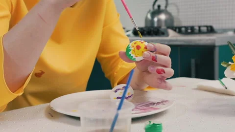 Close-up of a woman decorating eggs for Easter Stock Footage 219787385