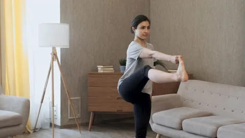 Close Up A Woman Does An Exercise for Balance, Stands on One Leg 스톡 동영상 158229273
