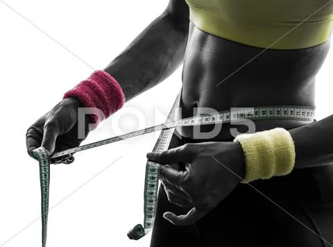 Close up woman exercising fitness measuring tape measure silhouette Stock Photos