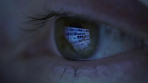 Close-up of woman eyes looking at monitor, working with computer, laptop Stock Footage 71648011