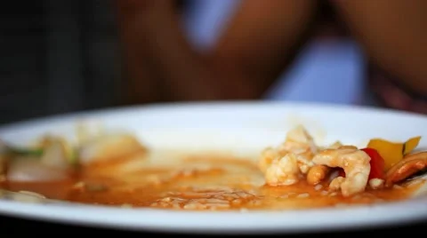 Close up of woman hand eats the leftovers stir fried chicken, vegetables with Video stock 44050480