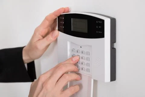 Close-up Of A Woman Hand Entering Code In Security System Stock Photos