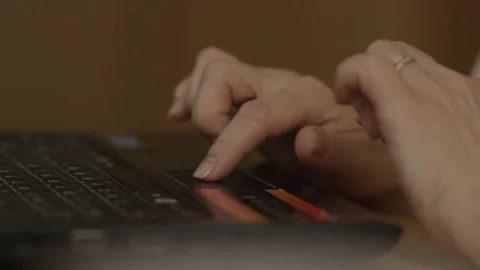 Close up of woman hand touching a tochpad on laptop. Close up of young Stock Footage