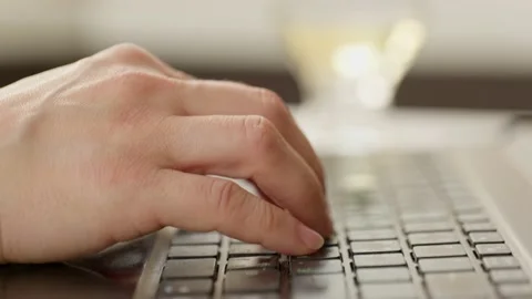 Close up woman hand using keyboard laptop on white table background. Stock Footage 131581627