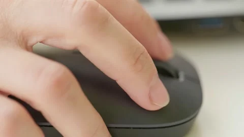 Close up woman hand using mouse laptop on wood table background. Stock Footage 131579881