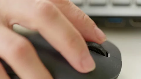 Close up woman hand using mouse laptop on wood table background. Stock Footage 131579888