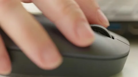 Close up woman hand using mouse laptop on table background. Stock Footage 131581935