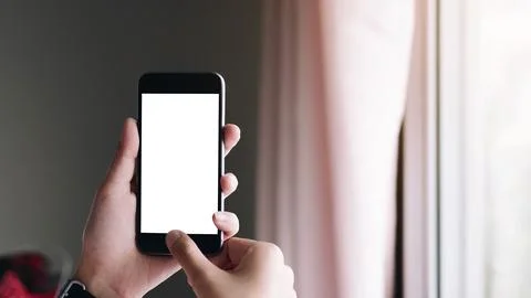Close up Woman hand Using a Smart Phone with blank screen at home Foto stock