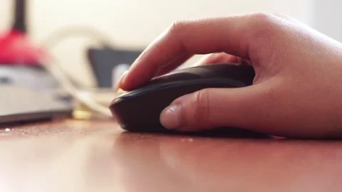 Close-up of a woman hand using white wireless mouse. Stock Footage 309020029