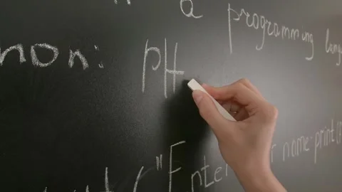 Close up of woman hand writing programming text and formulas on chalkboard Stock Footage 281578078