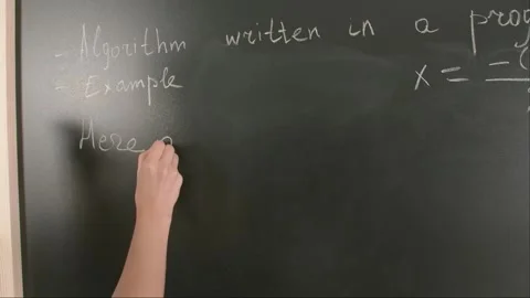 Close up of woman hand writing programming text and formulas on chalkboard Stock Footage 281578659