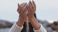 Close Up Woman Hands Pouring Sand Running Through Fingers On Beach Stock Footage