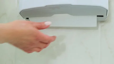 Close up of woman hands pulling tissues from towel dispenser in dental clinic Stock Footage 132360553