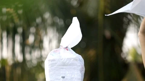 Close-up of woman hands pulling  tissues from white plastic  packet Stock Footage 148550819