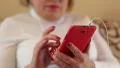 Close up of woman hands with red smartphone HD Footage