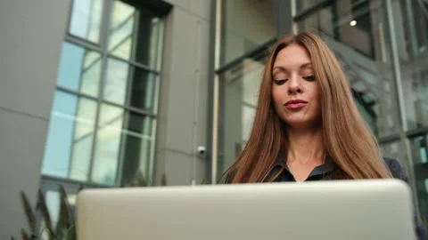 Close up of woman hands typing on computer. Casual female by sea and working Stock-Footage 143290939