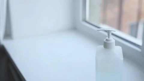 Close-up of woman hands using hand sanitizer gel to prevent spreading virus 스톡 동영상 126971599