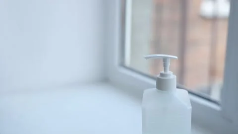 Close-up of woman hands using hand sanitizer gel to prevent spreading virus 스톡 동영상 126971888