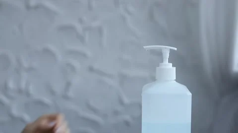 Close-up of woman hands using hand sanitizer gel to prevent spreading virus 스톡 동영상 126971932