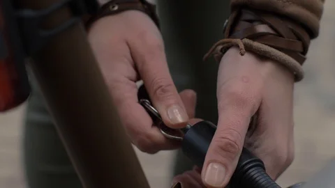 Close up woman hands using key for closing anti theft lock on bicycle parking Stock Footage 85642318