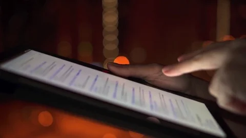 Close-up of woman hands using tablet computer touchscreen outdoors in city at Stock Footage 84824918