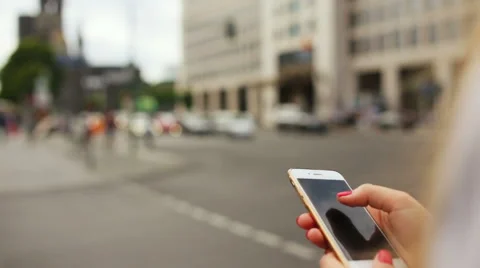 Close-up woman hands using touchscreen phone outdoors in city park,Berlin Stock Footage 67090069