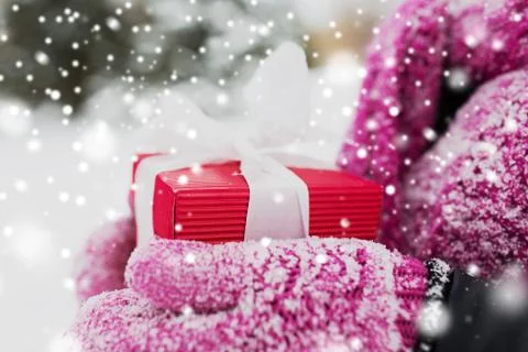 Close up of woman holding christmas gift outdoors Stock Photos