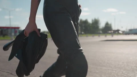 Close Up Woman Holding Jacket While Walking Outdoors Stock Footage 321116287