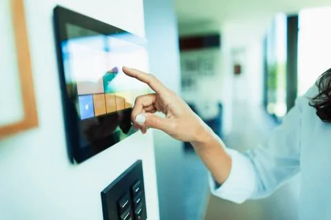 Close up woman at home automation touch screen panel Stock Photos