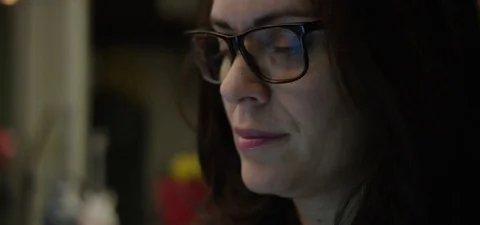 Close-up of woman looking at computer and smiling Stock Footage 75494578
