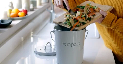 Close Up Of Woman Making Compost From Vegetable Leftovers In Kitchen Stock Footage 121191647