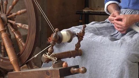 Woman At Spinning Wheel Making Yarn Stock Photo, Picture and