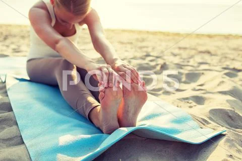 Close up of woman making yoga exercises outdoors Stock Photos