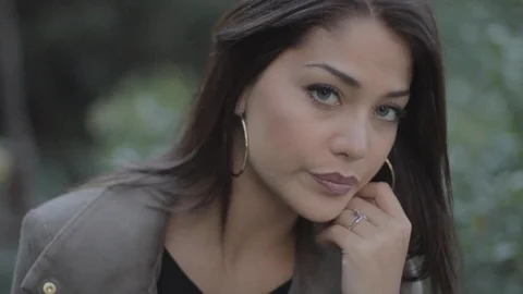 Close up of Woman model looking at camera on outdoor stairway surrounded by Stock Footage 110763082