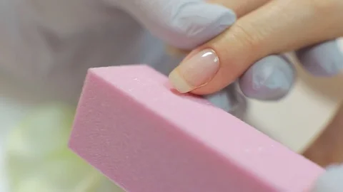 Close-up. Woman in a nail salon receiving a manicure by a beautician Stock Footage