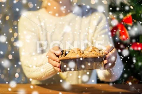 Close up of woman with oat cookies at home Stock Photos