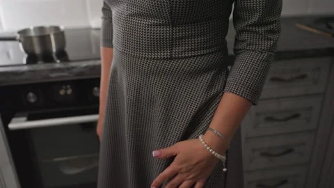 Close Up of Woman in Patterned Gown Dancing Joyfully in Kitchen Stock Footage 307989638