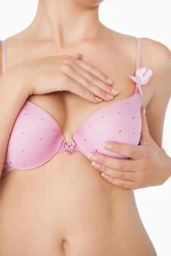 Close-up of woman performing self breast examination Stock Photos