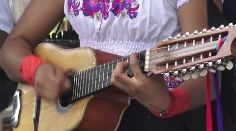Close up of woman playing a 12-string guitar Stock Footage 55301403