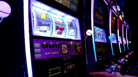 Close up woman playing slot machine inside Hard Rock Casino 動画素材 59209258