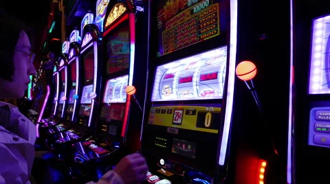 Close up woman playing slot machine Stock Footage 64007053
