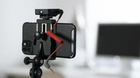Close Up Of Woman Plugging Microphone In Smartphone Stock Footage 135032939