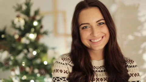 Close up woman portrait posing on tree lights background. , christmas holiday Stock Footage 69924366